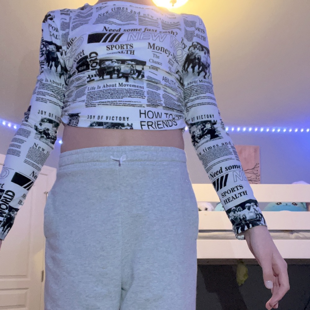 This is a cropped newspaper Shein shirt. It is very comfy and soft.